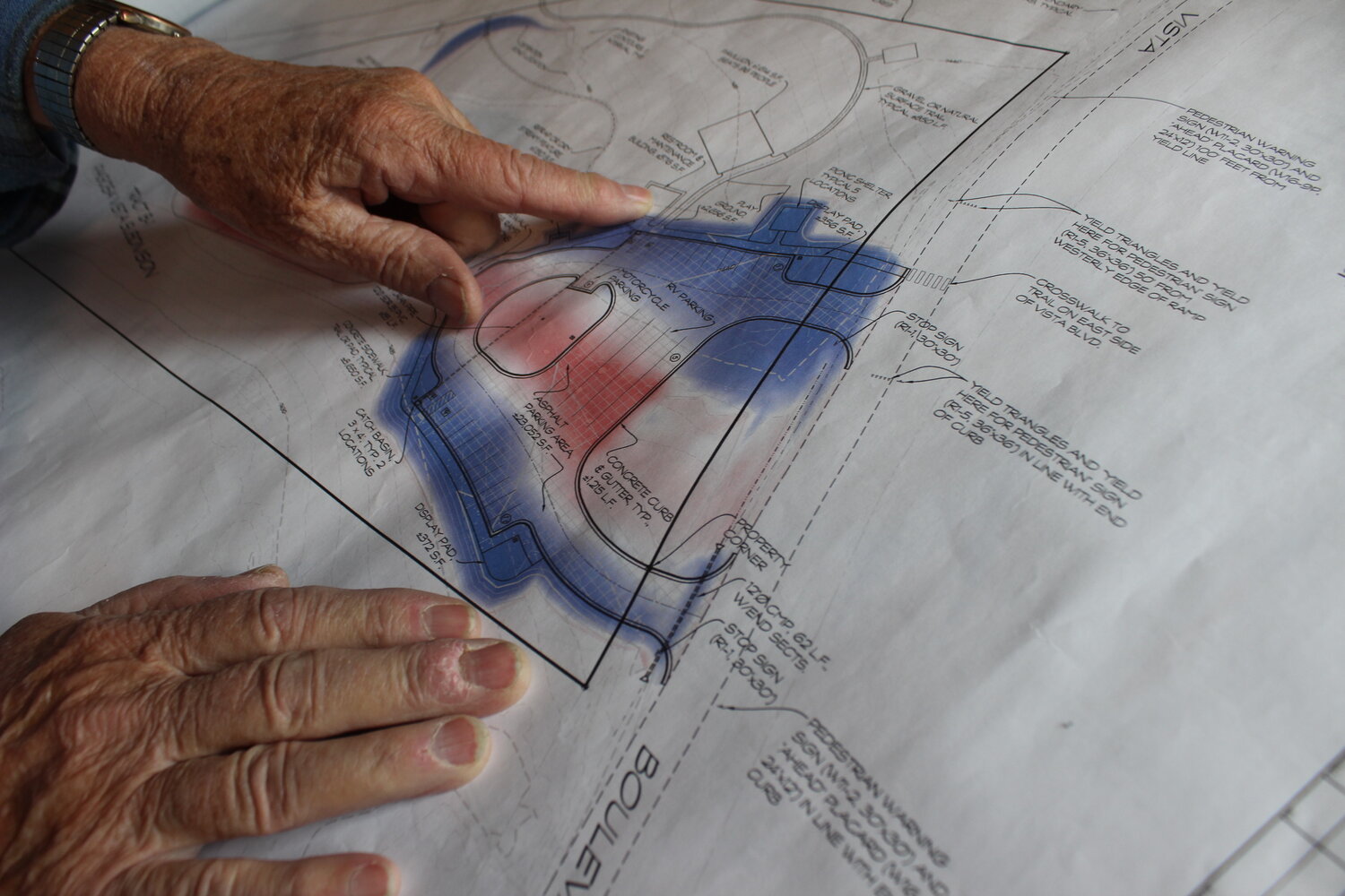 Jim Van Liere (pictured top) shows off plans for the Veterans Memorial Park of Archuleta County. Van Liere, a professional engineer, has been instrumental in the development of the park. Bottom right: A memorial brick honors Michael Glynn, Van Liere’s brother-in-law who was killed in Vietnam.